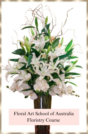 Happy Mother's Day.  I hope all the wonderful mothers have a very happy mother's day. This flower arrangement features liliums, orchids and contorted willow arranged in a tall container.