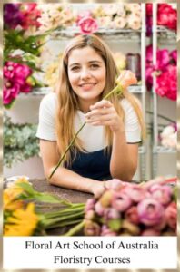 Florist surrounded with beautiful flowers. Floristry is a feel good industry where you can be creative.