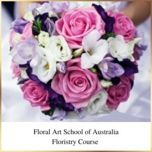 This round bridal bouquet features roses lizianthus and freesias. This style of bouquet is popular for brides and bridesmaids.