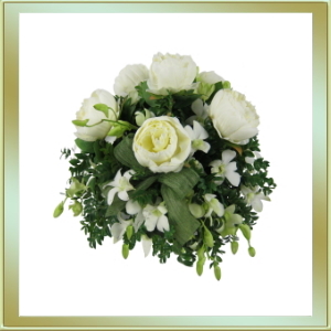 Flower arrangement featuring roses and orchids